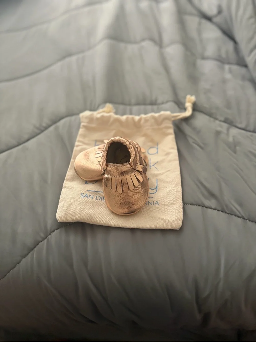 Metallic Rose Gold Baby Moccasins with Fringe